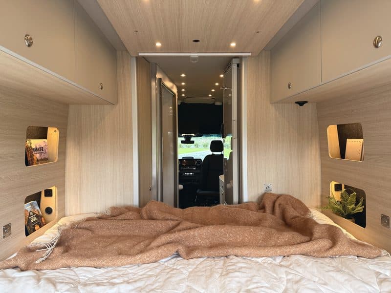 Looking forward from the bed through the van to the cab