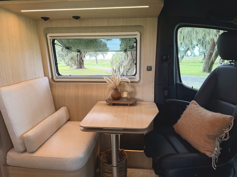 The dinette bench and table beside the passenger seat