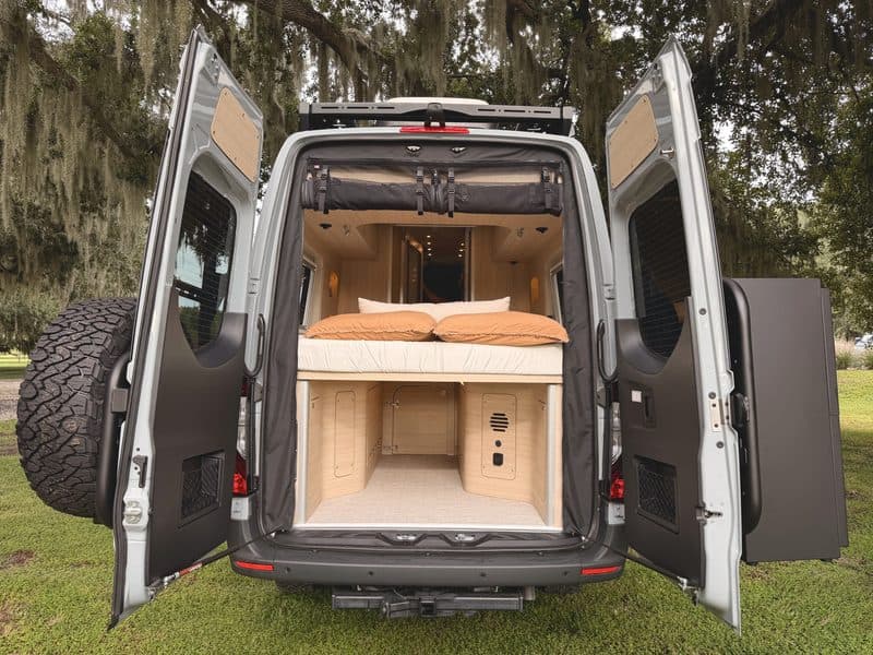 Nellie with the rear doors open, showing the bed and the storage space underneath