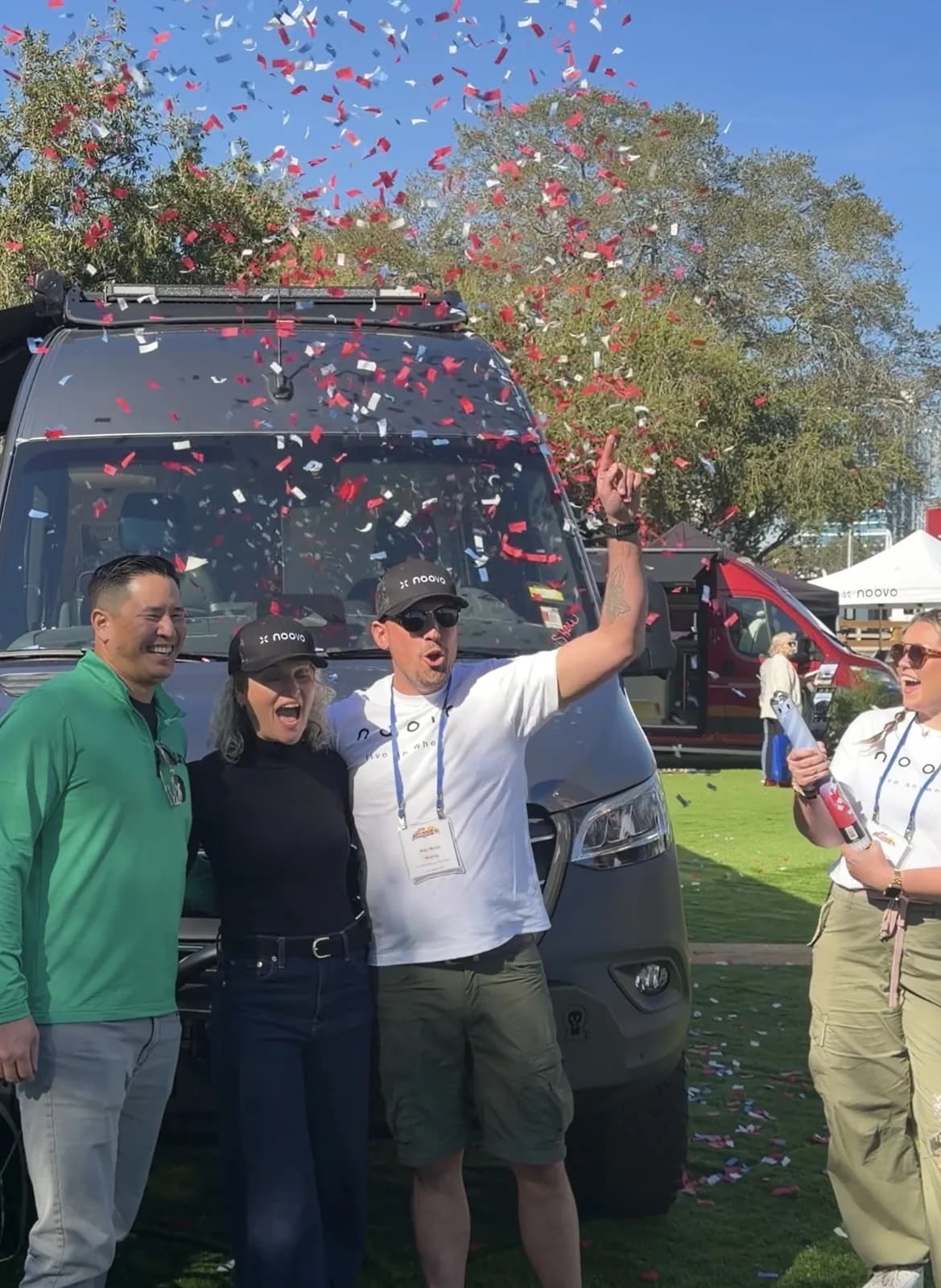 Randy and Linsey celebrating Nellie's delivery with the Noovo team as confetti flies