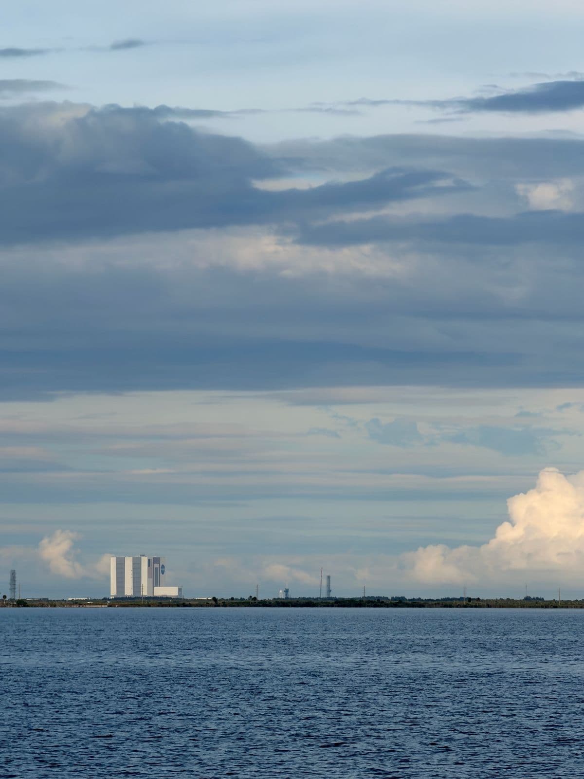 NASA's Vehicle Assembly Building at Kennedy Space Center, seen across the Indian River from the Manatee Hammock fishing pier in Titusville